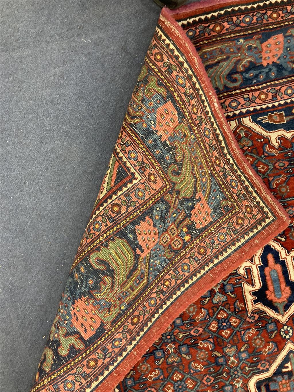 A red ground Shiraz rug, 204 x 132cm